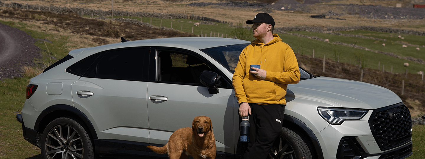 Pete Thornton enjoying coffee outdoors with his dog