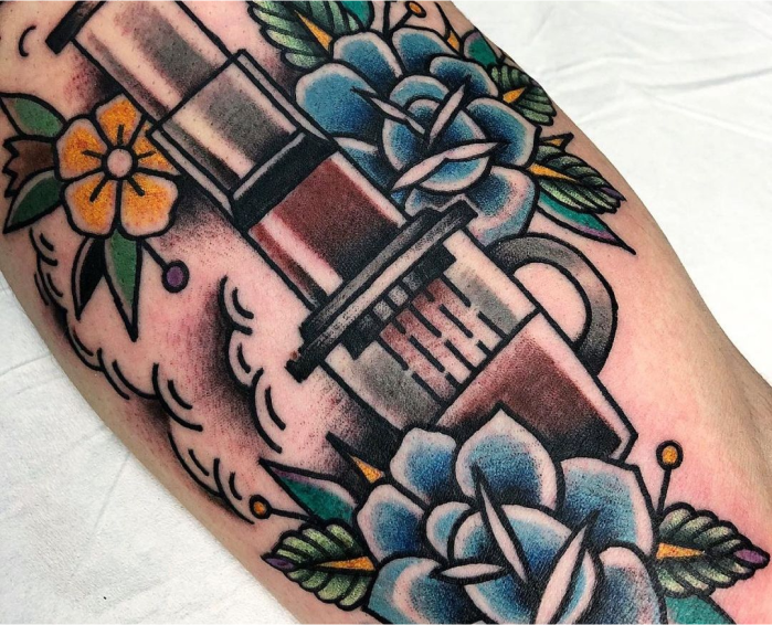 AeroPress tattoo with blue and yellow flowers