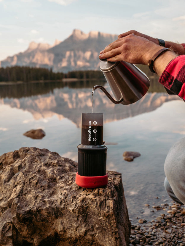 AeroPress Go next to mountain lake