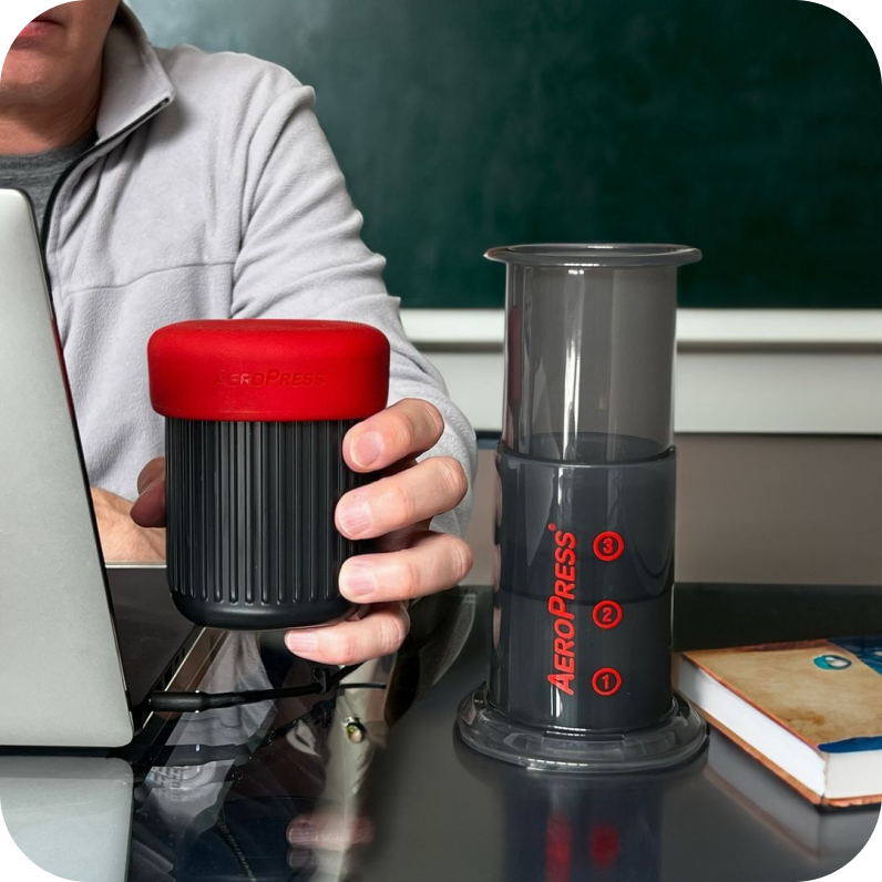AeroPress Go next to laptop