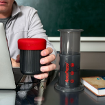 AeroPress Go next to laptop