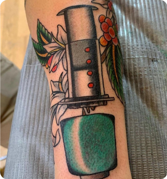AeroPress Tattoo with Green Cup and flowers