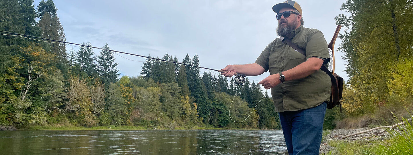 Ben Jones fishing by a river