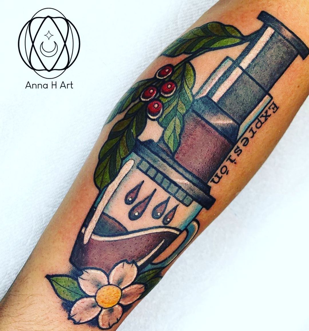 AeroPress tattoo with white flower and coffee cherries