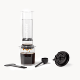 AeroPress Clear XL coffee maker with Variable flow control cap on a white background