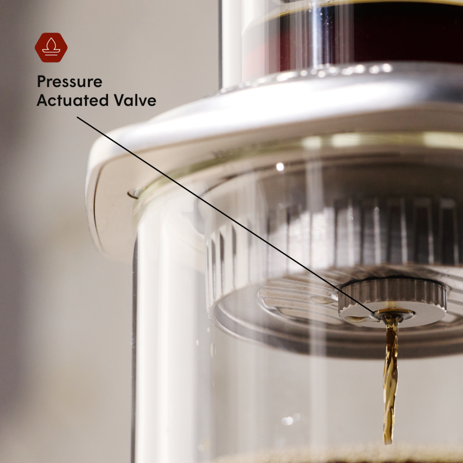 Close-up of a pressure actuated valve with a label pointing to it.