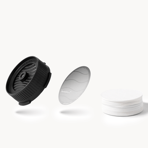 AeroPress Flow Control Cap, Stainless Steel Filter and paper micro-filters on a white background