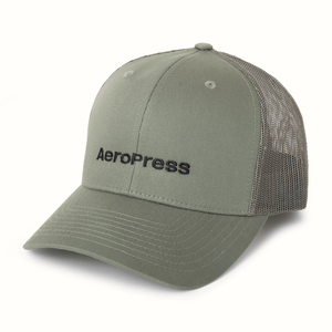 Green cap with AeroPress logo on a white background 
