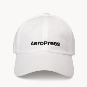 White cap with AeroPress logo on a white background #color_white