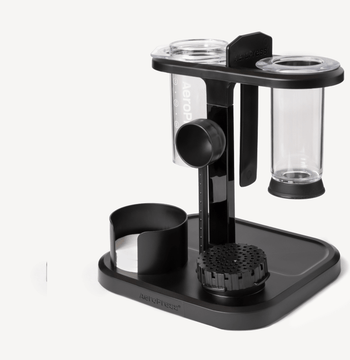 Black and clear coffee brewing device on a white background