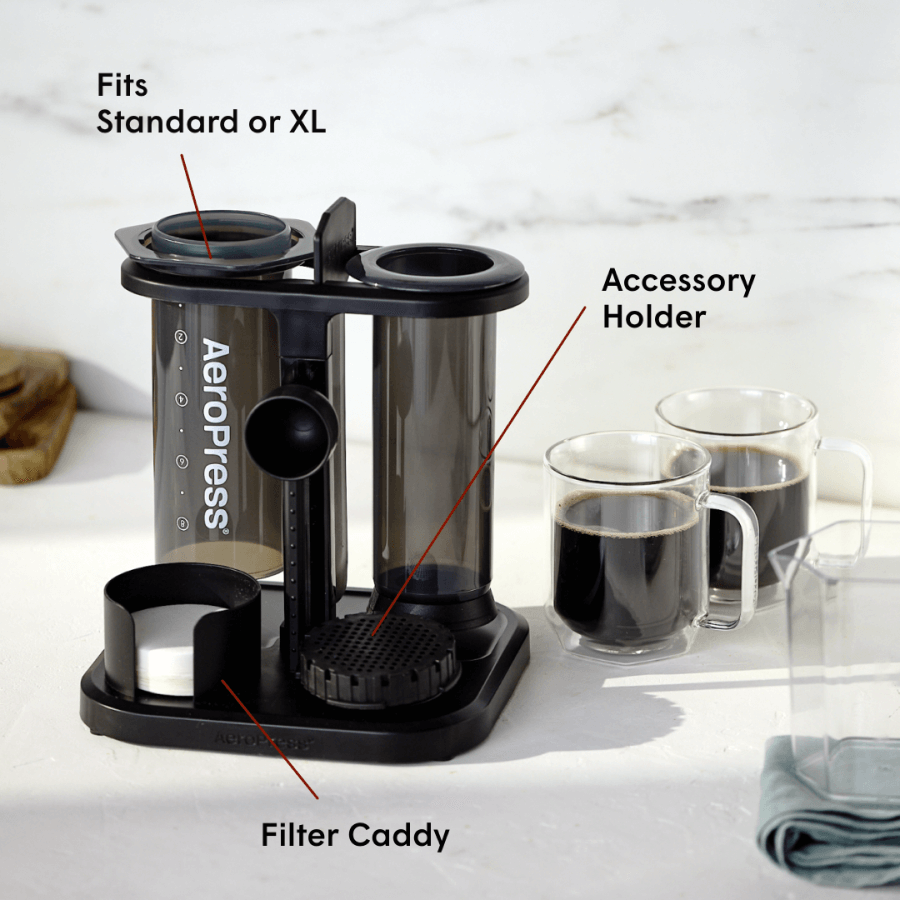 Aeropress coffee maker with labeled parts on a white background