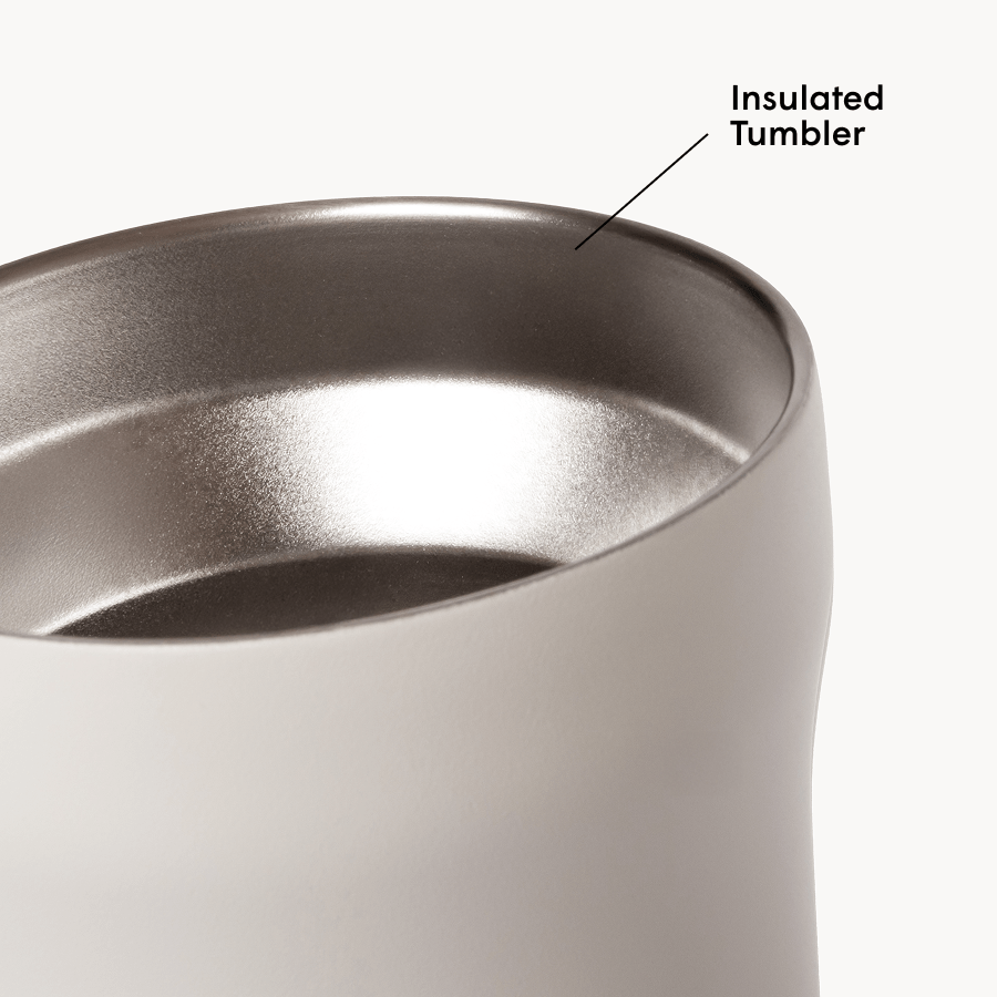 Black insulated tumbler with metallic interior on a white background #color_cream