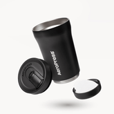 Black AeroPress tumbler with components on a white background #color_black