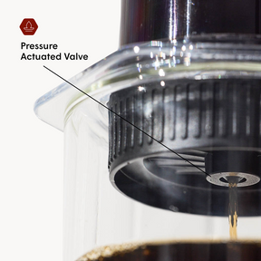 Close-up of a pressure actuated valve on the AeroPress Flow Control Cap with labeled component. #color_green