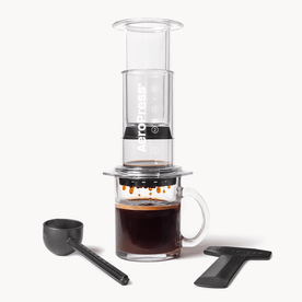 AeroPress Coffee Maker - Clear on glass coffee mug #color_clear