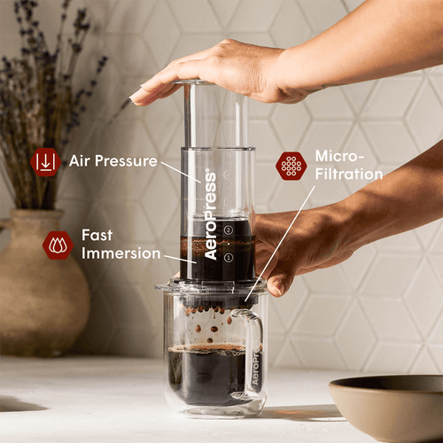 AeroPress Coffee Maker - Clear on glass coffee mug #color_clear