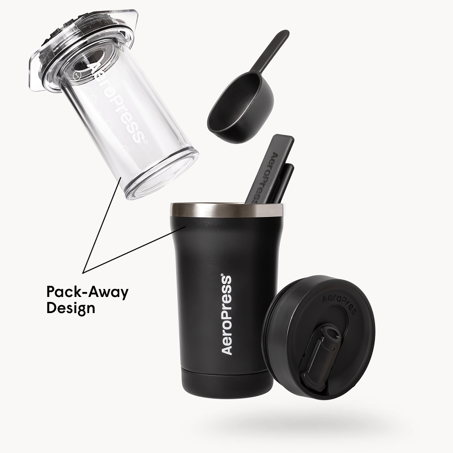 AeroPress Go Plus coffee maker with components on a white background #color_black