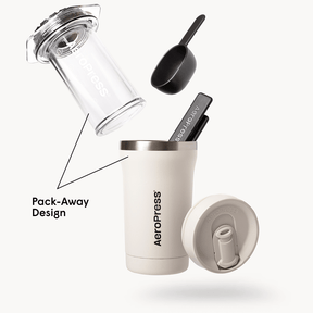 AeroPress Go Plus coffee maker with components on a white background #color_cream