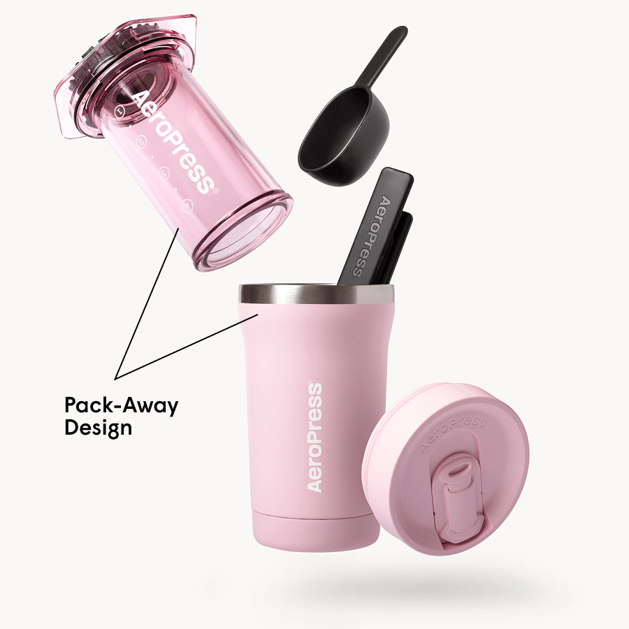 Pink AeroPress Go Plus coffee maker with components on a white background #color_pink