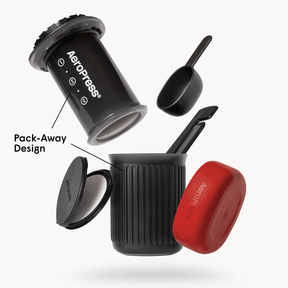 AeroPress Go coffee maker with mug and components on a white background