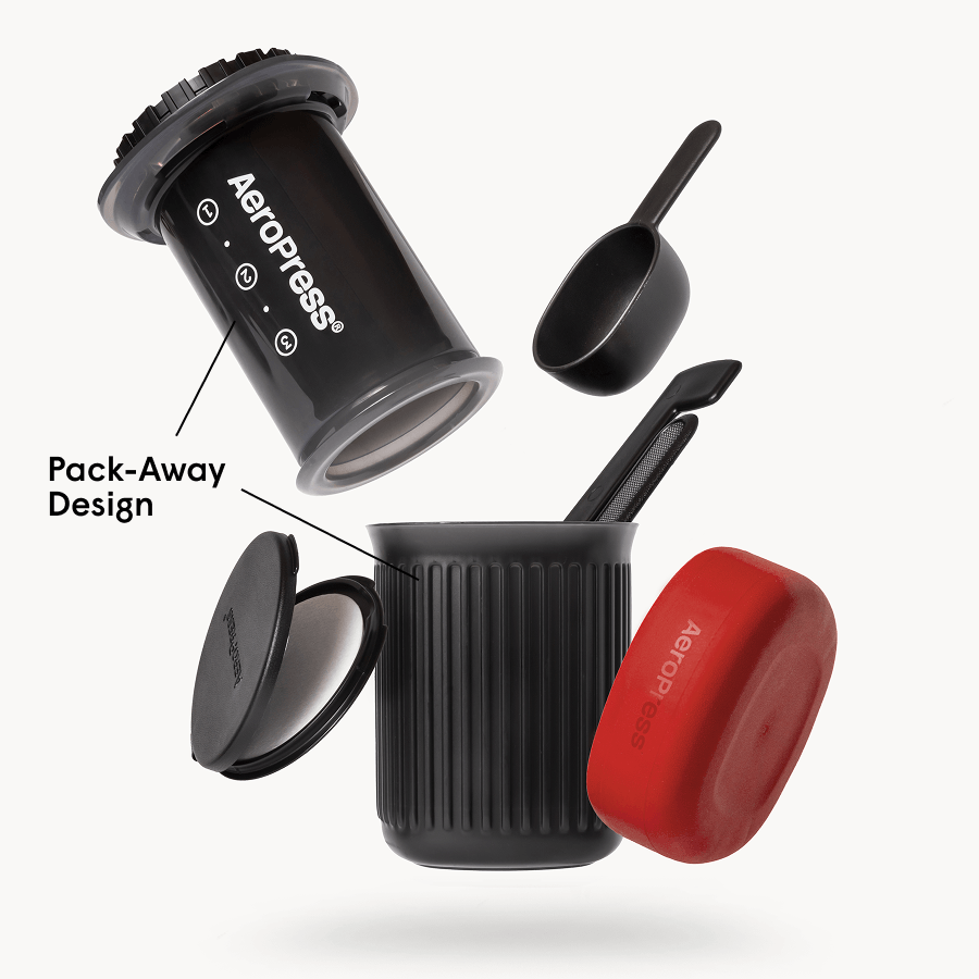 AeroPress Go coffee maker with mug and components on a white background