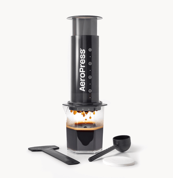 AeroPress XL coffee maker with a carafe of brewed coffee on a white background