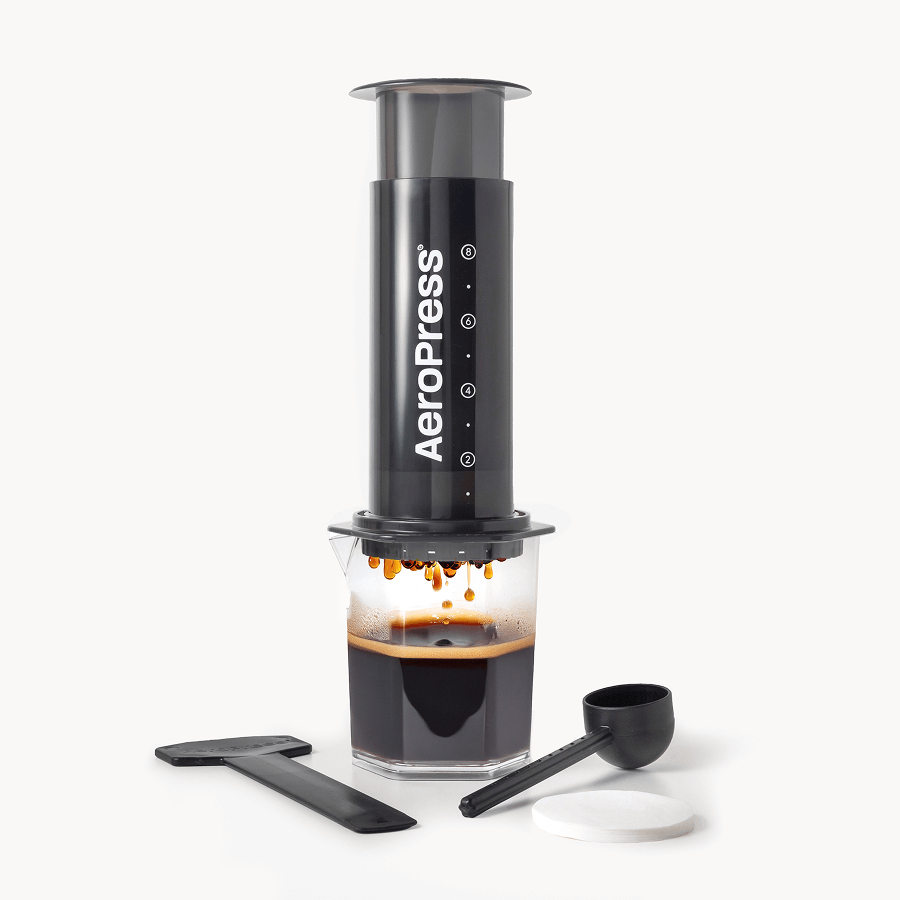 AeroPress XL coffee maker with a carafe of brewed coffee on a white background