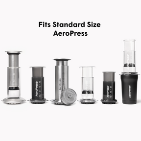Collection of AeroPress coffee brewing devices on a white background