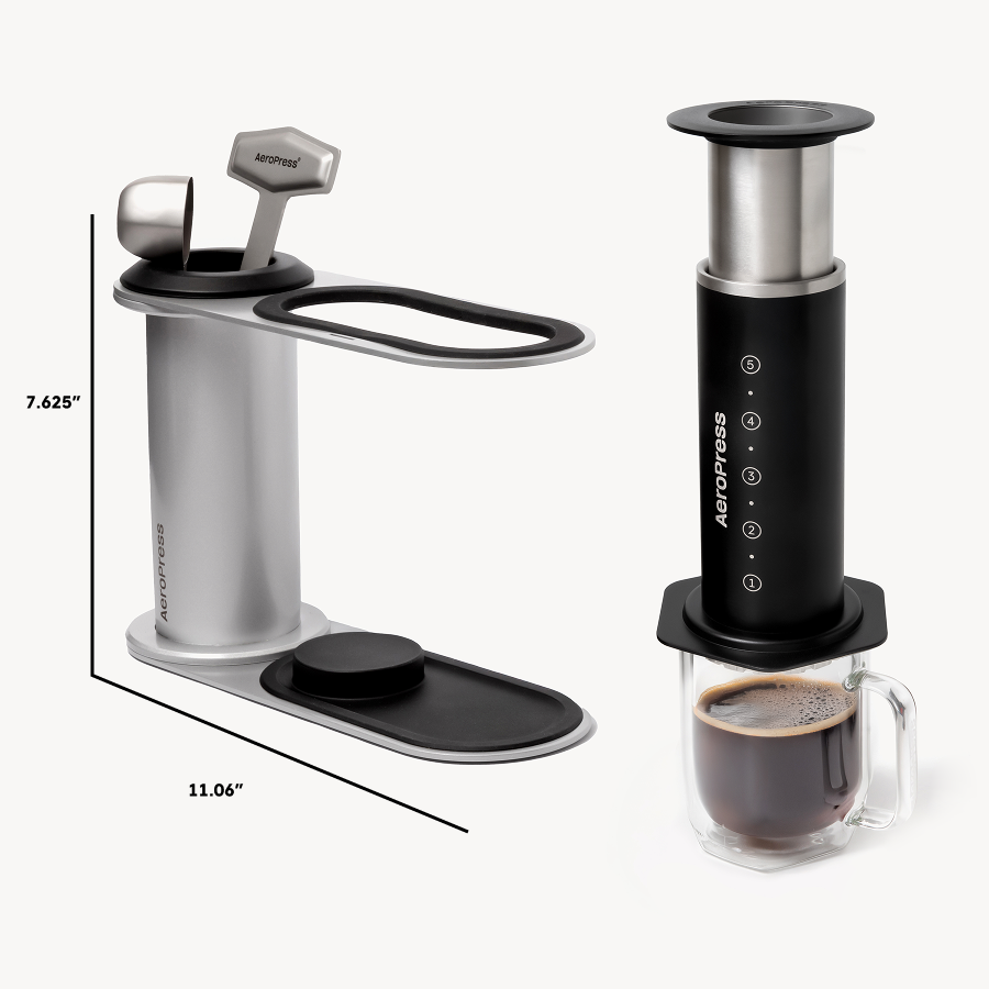 Aeropress coffee maker with a glass mug of coffee on a white background #color_black
