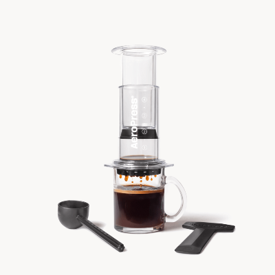 AeroPress Coffee Maker - Clear on glass coffee mug #color_clear
