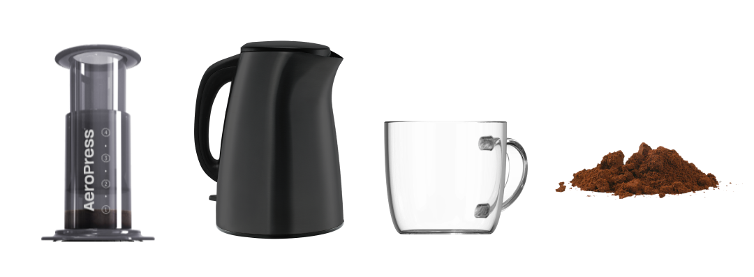 AeroPress Original next to kettle, glass mug and ground coffee