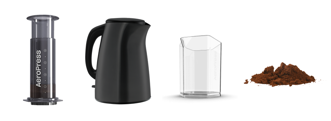 AeroPress XL next to kettle, carafe and ground coffee