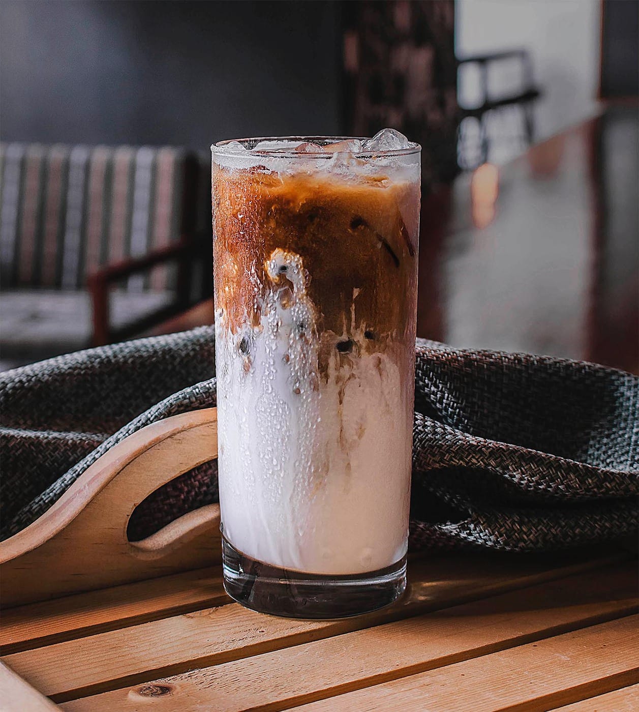 A glass of cold brew coffee with milk and ice