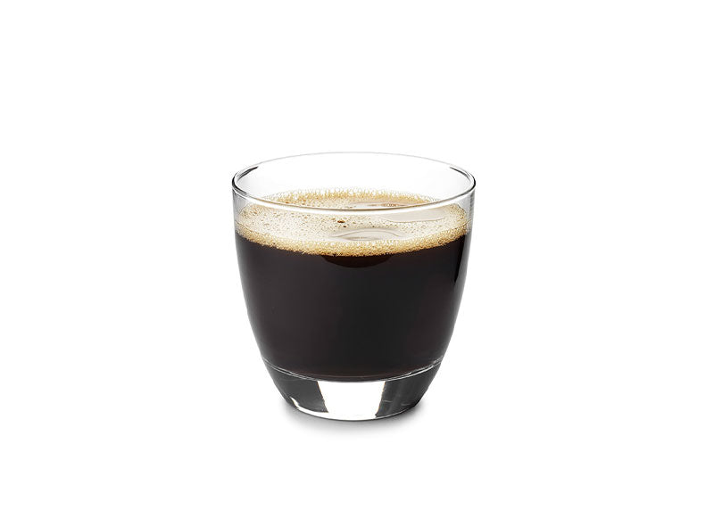 A glass containing espresso